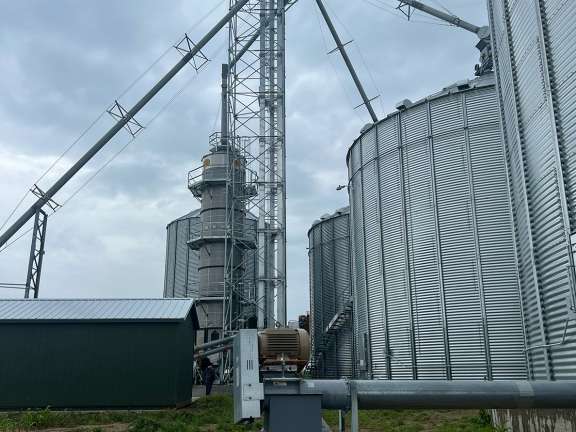Material handling system with GSI tower dryer, and grain bins near Hartford SD